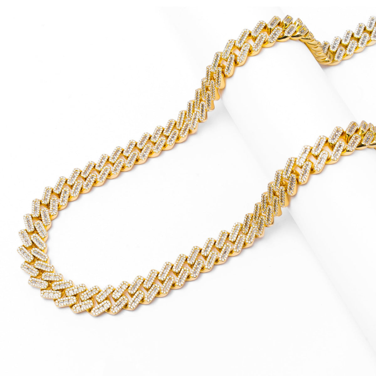 Full length view of 12MM Cuban chain with diamond-cut links and iced out baguette design