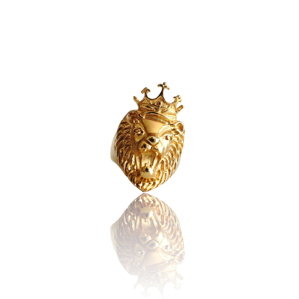 Gold lion head ring with crown on white background