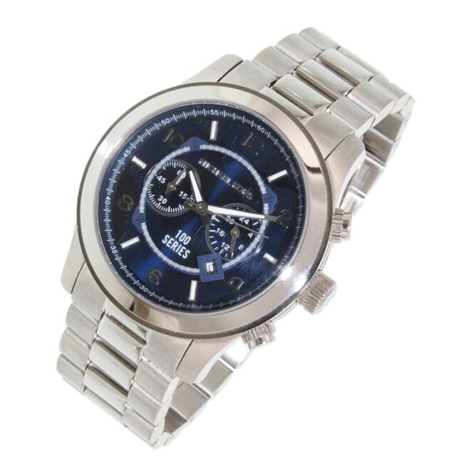 Michael Kors MK8314 chronograph watch at angle showing silver bracelet and navy dial