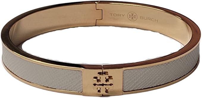 Tory Burch white and gold bangle with signature logo plaque and hinged closure