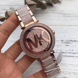 Michael Kors Parker Crystal Pave Logo Dial Ladies Watch MK6176 Water resistance: 100 meters / 330 feet Movement: Quartz