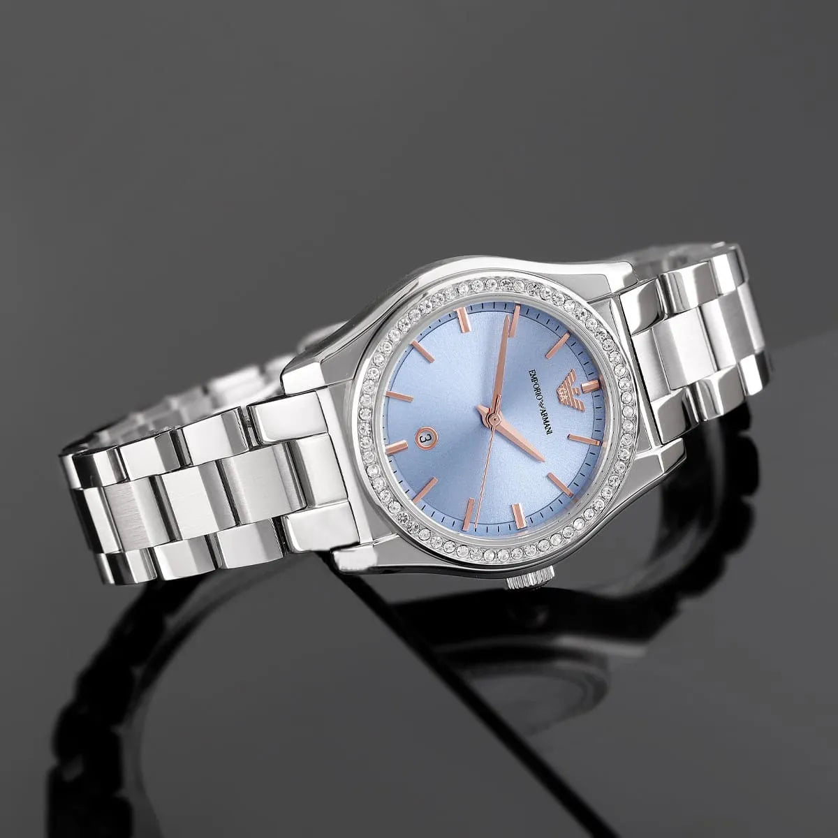 Emporio Armani Federica watch with blue dial and crystal bezel on neutral background