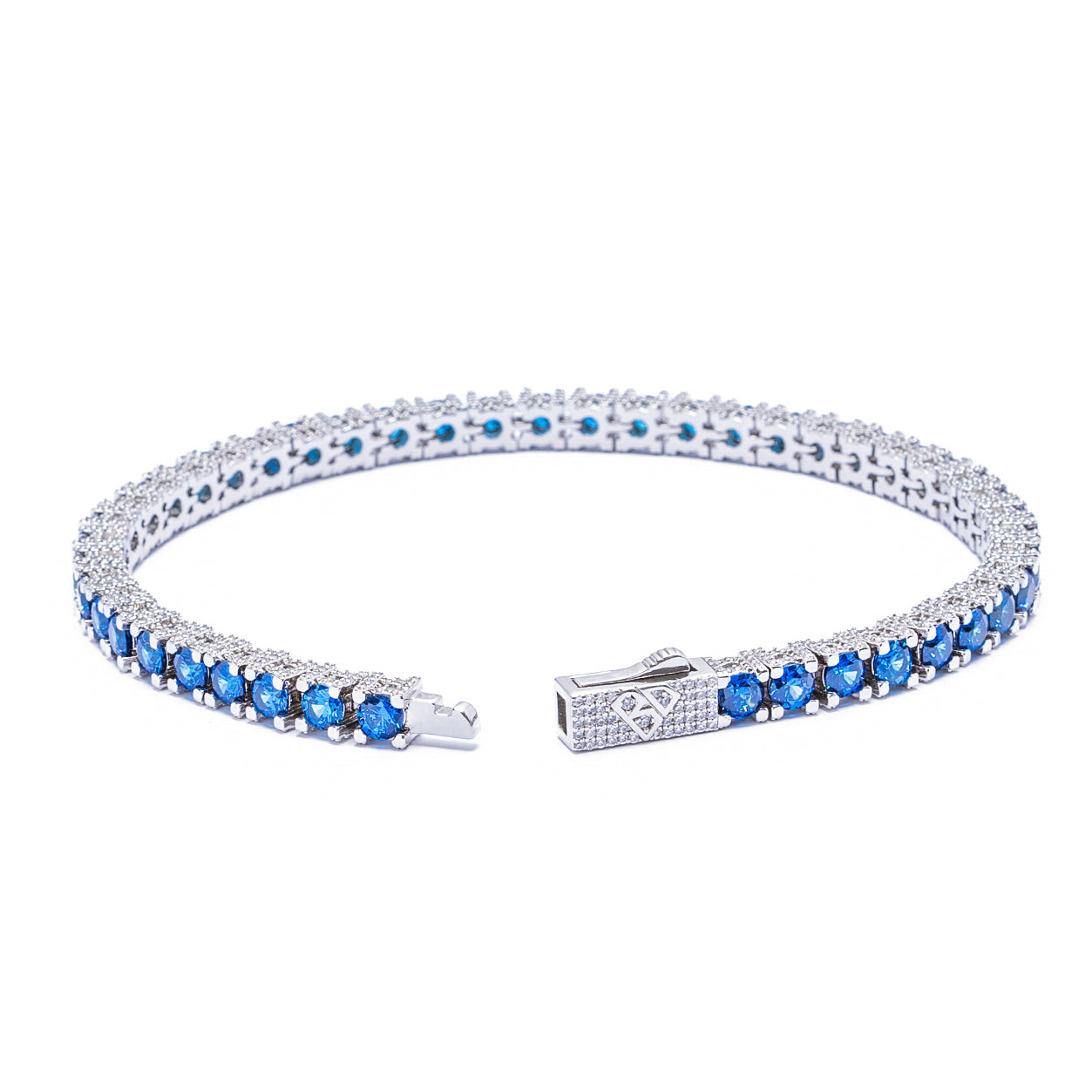 Side angle view of silver tennis bracelet with blue stones and clasp detail