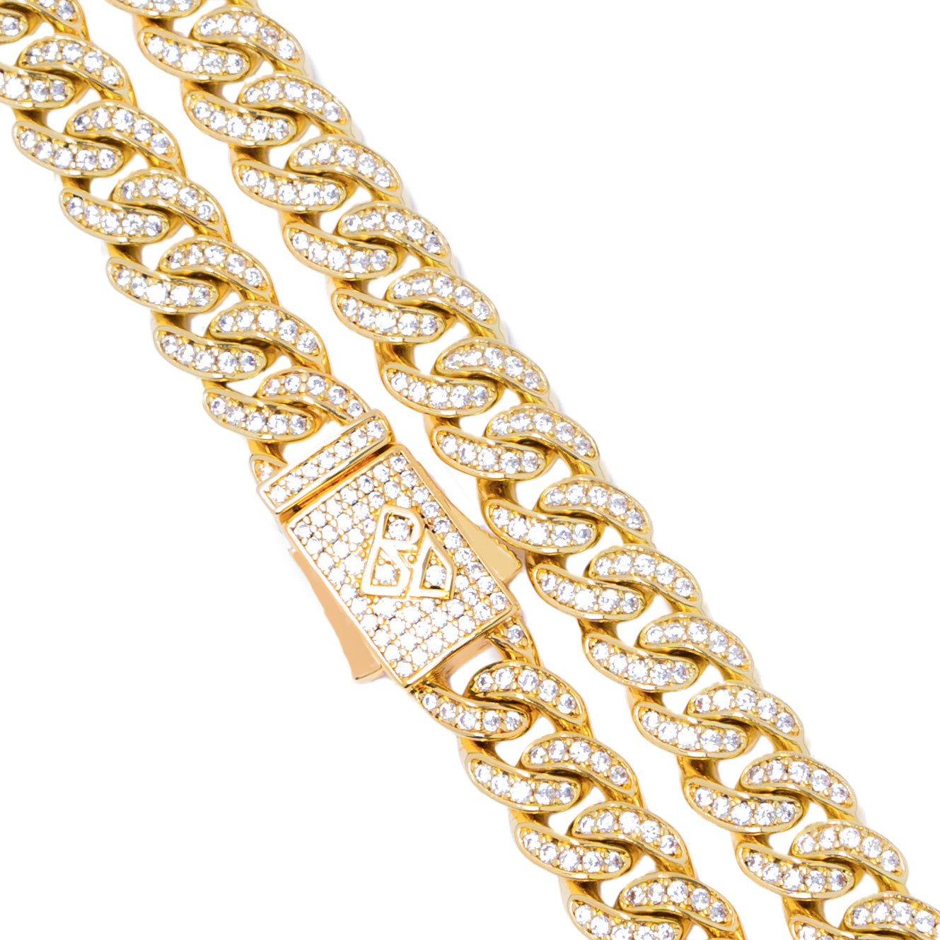 Gold Cuban curb chain detail with crystal-encrusted clasp and links