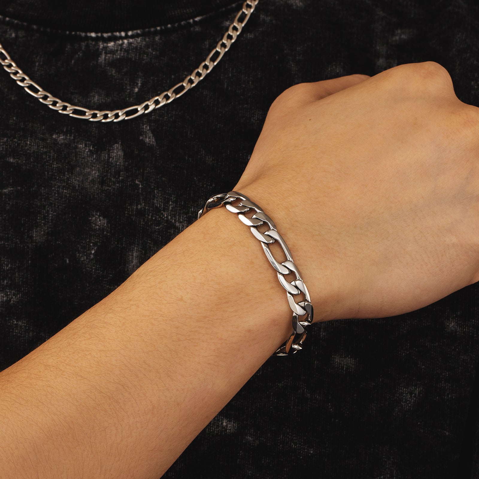 9mm steel Figaro silver bracelet worn on wrist showing chain detail