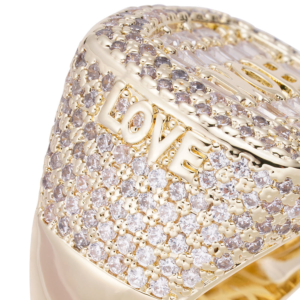 Close-up detail of MOB engraving and baguette diamond settings on ring top