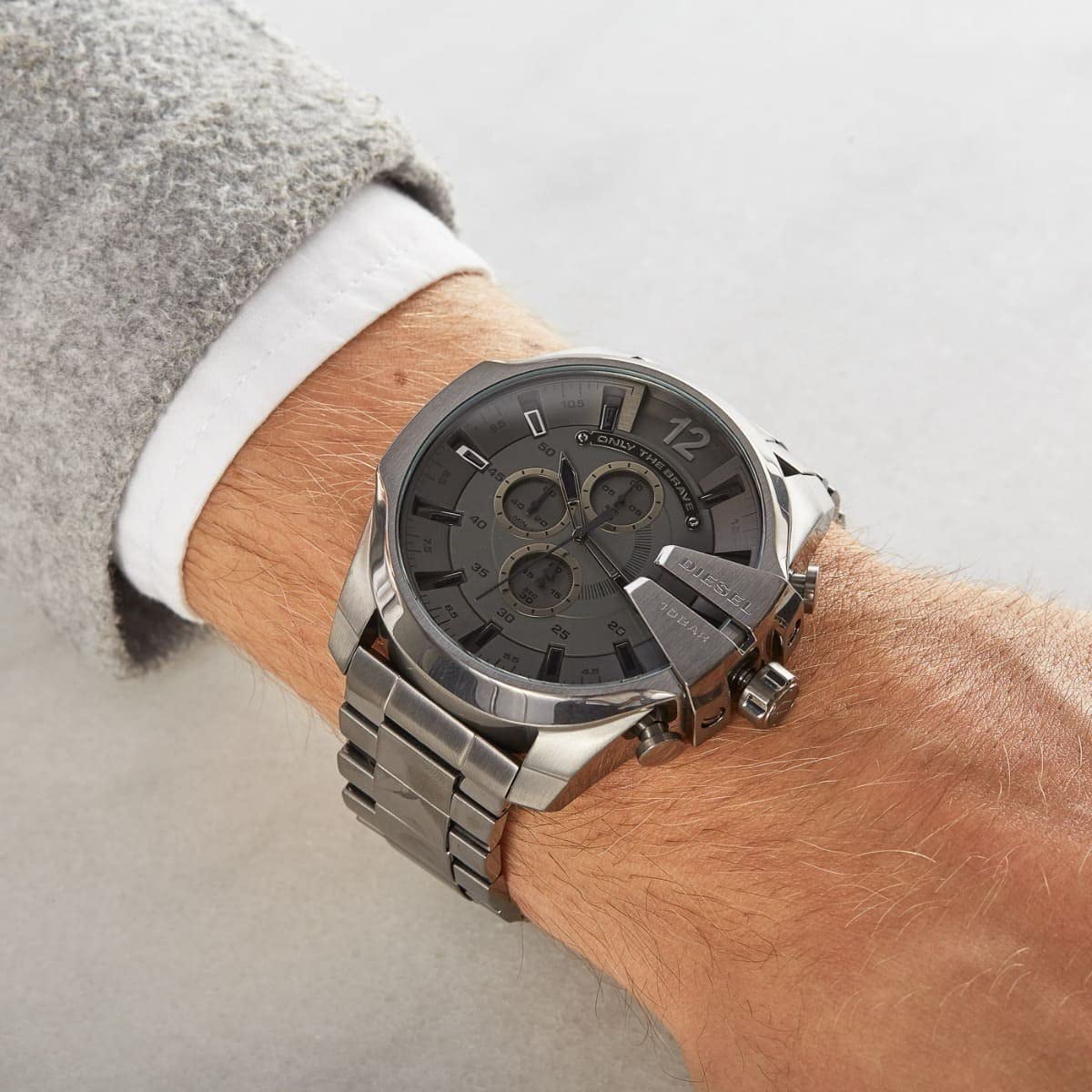 Diesel Mega Chief watch on wrist with grey dial and gunmetal case detail