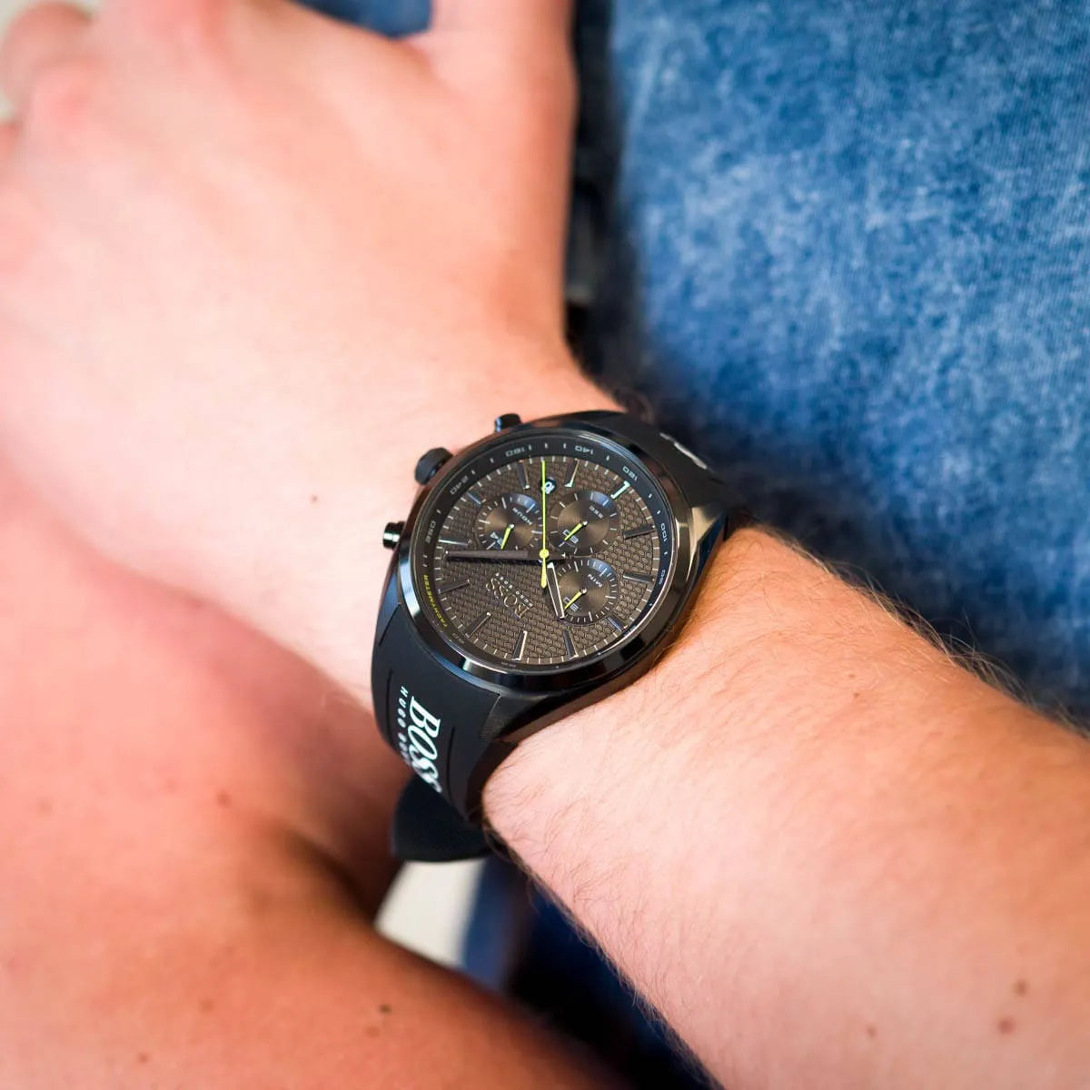 Hugo Boss Distinct chronograph watch on wrist showing black dial with yellow chronograph hands