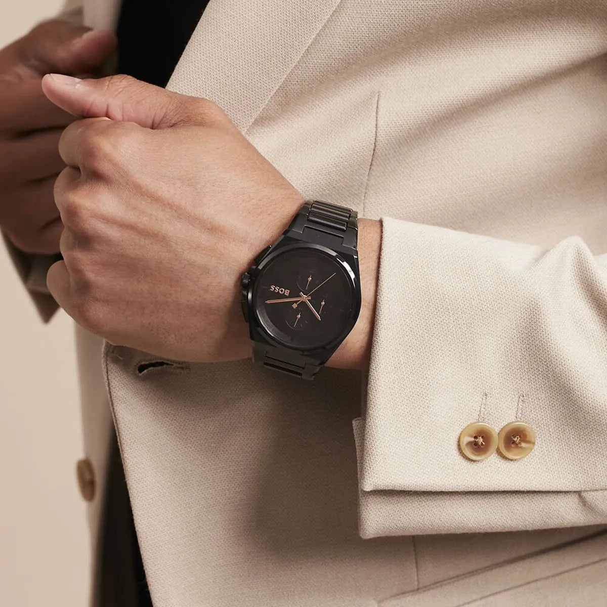 Hugo Boss Steer watch on wrist showing chronograph dial and metal bracelet