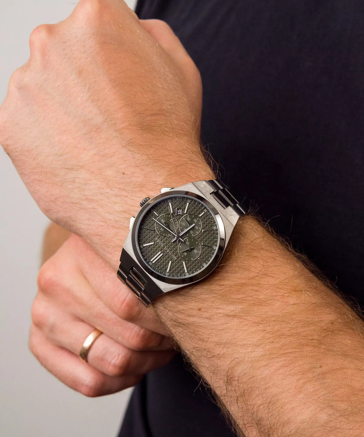 Michael Kors Lennox Chronograph watch worn on wrist showing olive dial