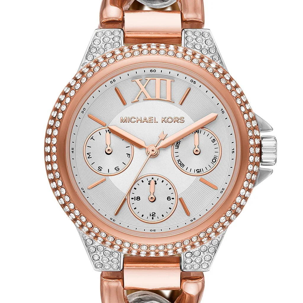 Close-up of Camille watch dial showing silver surface with rose gold markers and three chronograph subdials