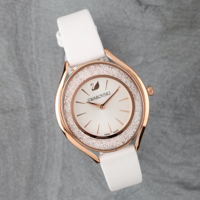 Side angle view of Swarovski Crystalline Aura watch with white strap and crystal-set bezel