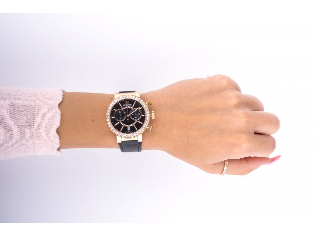 Swarovski Lovely Crystals chronograph watch worn on wrist with black dial and rose gold case