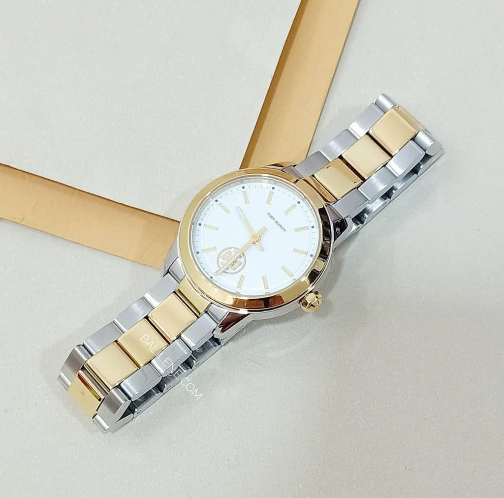 Tory Burch Collins Petite watch on wrist with two-tone yellow gold and stainless steel bracelet