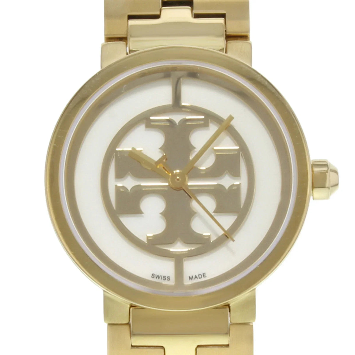Close-up of Tory Burch Reva dial showing small logo design and Swiss made marking
