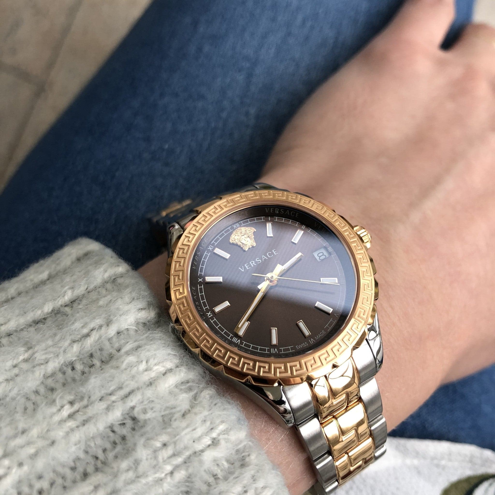 Versace Hellenyium ladies watch worn on wrist with brown dial and Greek key bezel
